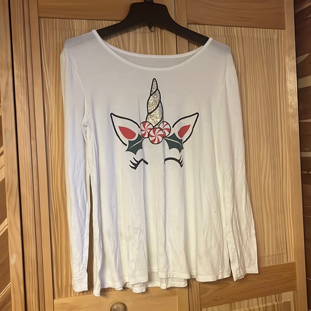 Cute Christmas shirt the brand is Justice the size is 14/16 plus